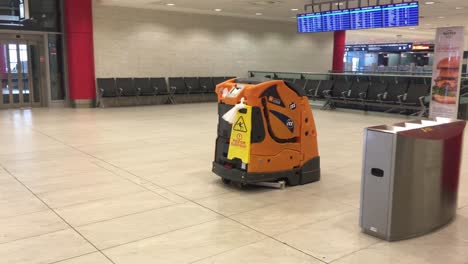 Taski-Intellibot-Swingobot-2000-on-Prague-International-Airport,-modern-cleaning-device-using-artificial-intelligence