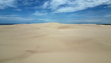 Aerial-shot-of-the-empty-shifting-sand-dunes-at-stockton-beach