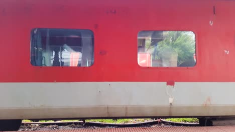 indian-passenger-express-train-leaving-station-on-track-at-evening-from-flat-angle-video-is-taken-at-kamakhya-railway-station-assam-india-on-May-22-2022