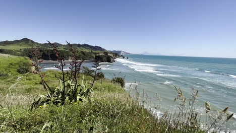 Ocean-Waves-At-Three-Sisters-And-The-Elephant-Beach-In-Taranaki-Region-of-New-Zealand
