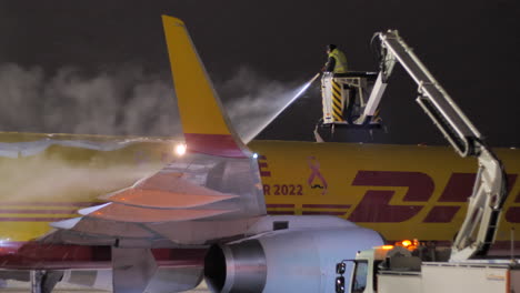 DHL-Cargo-Aircraft,-Boeing-757-de-iced-at-Brno-airport,-Czech-republic