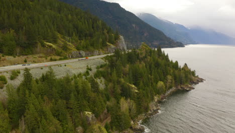 Aerial-drone-view-of-a-mountain-highway-along-the-Pacific-Coast-in-British-Columbia,-Canada
