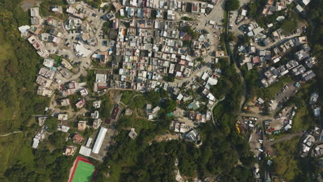 Drone-top-shot-of-crowded-housing-in-Hongkong-city,-China