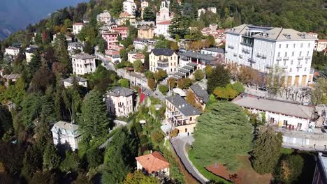 Beauty-of-Italian-village-of-Brunate-situated-on-forestry-mountain,-aerial-view