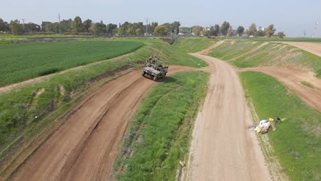 -Israel-Army-Golani-Infantry-Brigade-Soldiers-at-Training-Ground-Practice-Balancing-Military-Humvee-Vehicle-Driving-on-Inclined-Country-Road---Aerial-Tracking