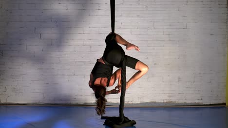 Amazing-performance-of-a-flexible-woman-performing-and-training-aerial-dance-routine,-aerial-dancer