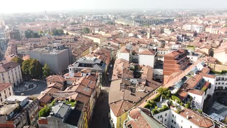 Cityscape-of-Bergamo-city-on-sunny-day,-aerial-drone-view