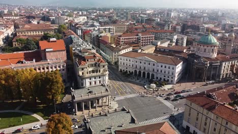 Street-intersection-and-rooftops-of-Bergamo-city,-aerial-drone-view