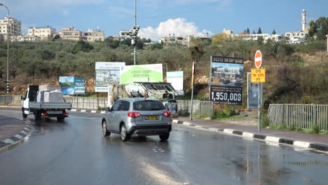 Cars-Drive-by-Israel-Army-Road-Checkpoint-with-Soldiers-on-Sentry-Duty-on-Sunny-Day