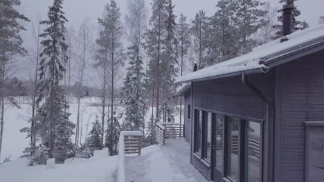 Winter-cabin-covered-with-snow-in-ski-resort-in-Finland