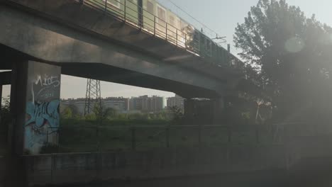 Subway-ride-on-concrete-bridge-in-Milan,-view-from-bellow