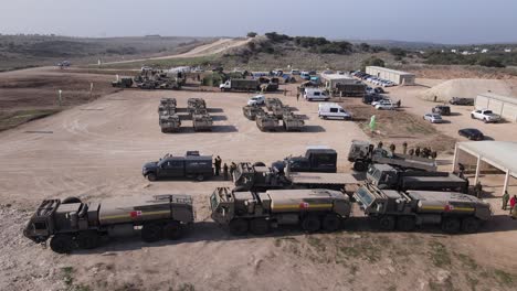 Israel-Army-Golani-Infantry-Unit-Training-Ground-Camp---Aerial-Dolly-Revealing-MICV-and-HEMTT-Military-Vehicles