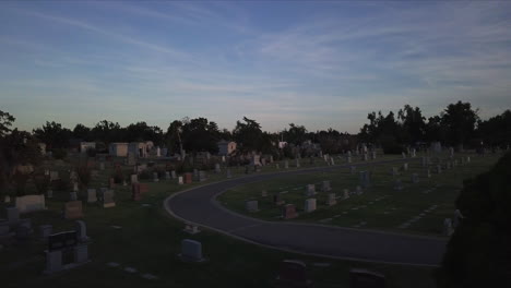 low-aerial-dolly-above-a-graveyard-with-fading-light