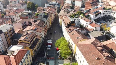 Vibrant-colorful-cityscape-of-Bergamo-city,-aerial-fly-backward