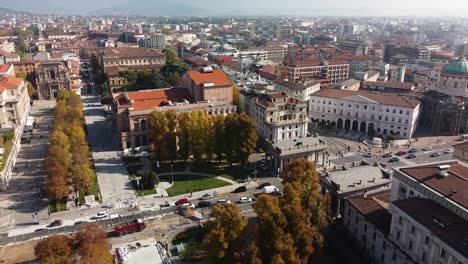 Rooftops-of-Bergamo-city-on-warm-sunny-day,-aerial-side-fly-view