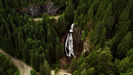 Waterfall-Vladeasa-Peak-and-Bride's-Waterfall-Region-Romania,-Aerial-Top-Down-Orbital-View,-Green-Forest-Pine-Trees,-Trail-Path