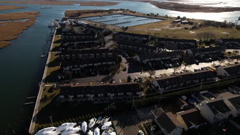 An-aerial-view-over-a-residential-neighborhood-by-the-salt-marshes-in-Freeport,-NY-on-a-sunny-day