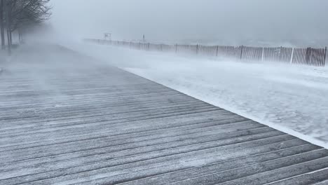Snow-Blizzard-With-Boardwalk-Near-The-Shoreline.-Handheld
