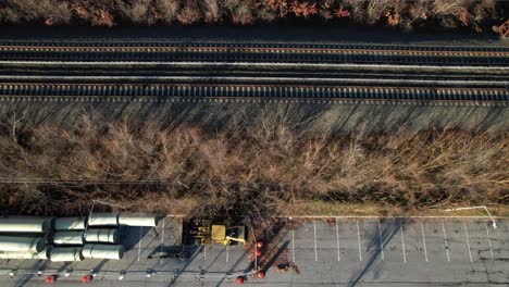 A-drone-view-of-a-fenced-off-area-by-train-tracks