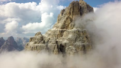 Huge-Mountain-Top-being-uncovered-by-the-clouds-Three-peaks-of-Tre-cime-di-Lavaredo,-Belluno,-Dolomite,-Italy