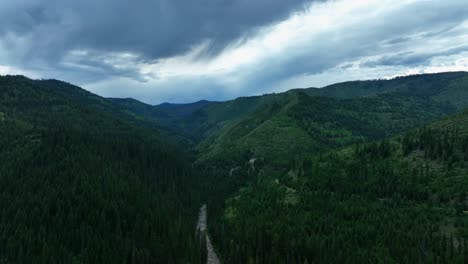 Aerial-View-Of-River-Between-Forests-In-Missoula-County,-Montana---drone-shot