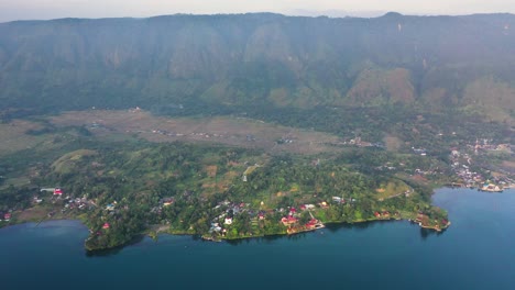 Aerial-view-of-small-villages-on-Samosir-Island-in-Lake-Toba-in-North-Sumatra,-Indonesia