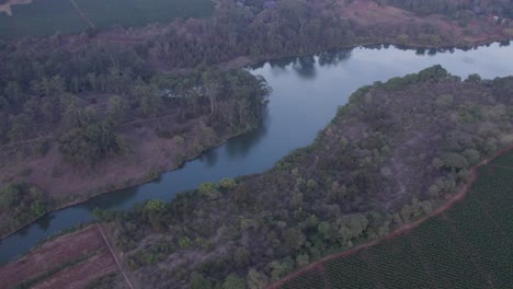 Aerial-Shot-Of-Beautiful-Lake-Path-in-Heart-Of-Peaceful-Green-Nature,-Kenya