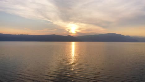 Aerial-view-over-Lake-Toba-at-sunset-in-North-Sumatra,-Indonesia