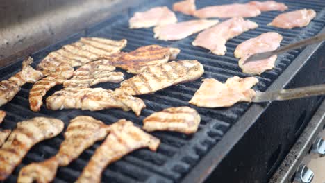 Grill-chicken-breast-and-turn-over-with-tongs