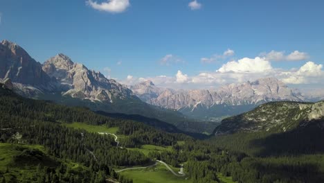 Green-valley,-Pine-tree-forest-in-the-Dolomites-Mountains,-San-Vito-di-Cadore,-Belluno,-Italia,-Europe