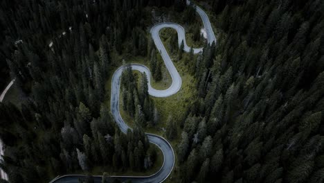 Aerial-drone-footage-of-snake-road-Passo-Giau,-cars,-travel,-road
