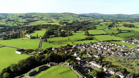Denbighshire-residential-suburban-North-Wales-countryside-righ-pan-across-housing-estate-aerial-view