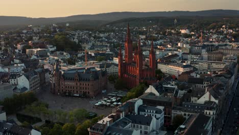 Marktkirche-Wiesbaden-Germany-in-red-light-with-a-drone-right-before-magic-hour