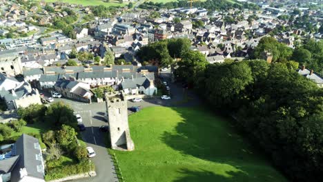 St-Hilarys-tower-Denbighshire-residential-Welsh-historic-village-North-Wales-aerial-descending-view