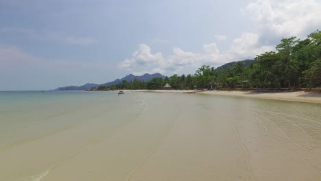 Dolly-Aerial-shot-of-enmpty-beach-in-tropical-Koh-Chang-with-Jungle-sea-view