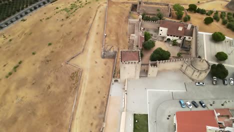 Aerial-view-of-an-old-castle-moving-down-into-the-gate