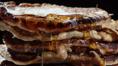 Maple-Syrup-Dripping-In-Slow-Motion-On-The-A-Stack-Of-Delicious-Pancakes---close-up