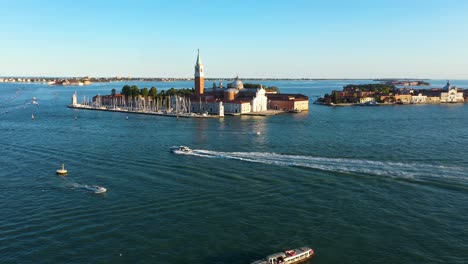 Aerial-view-rising-above-Church-of-San-Giorgio-Maggiore-during-sunset-in-Venice-in-Italy-in-4k