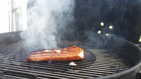 Turning-a-seared-salman-steak-over-on-the-grill-and-smelling-that-barbecue-smoke