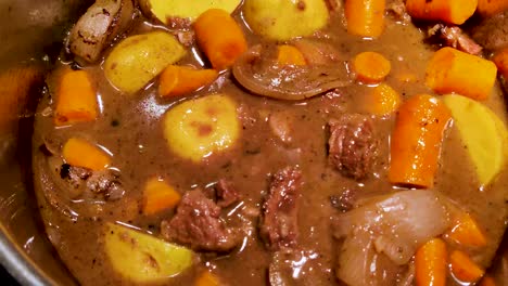 Making-the-best-red-wine-beef-stew-including-chuck-roast,-red-wine,-potatoes,-and-carrots