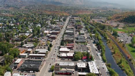 Aerial-view-over-the-Yampa-river-and-Downtown-Steamboat-Springs,-Colorado
