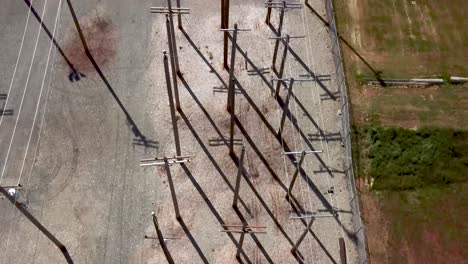 Top-down-Shot-Of-Telephone-Poles-At-The-Training-Grounds-Of-Bates-Technical-College-In-Tacoma,-Washington---aerial