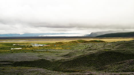 Aerial-dolly-out-shot-of-a-lowland-and-stormy-clouds-in-the-Fjallsárlón-area