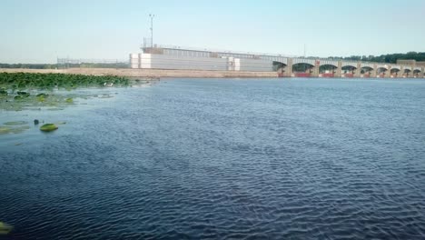 Low-flyover-of-edge-of-lily-pads-and-moving-toward-the-dike-for-Lock-and-Dam-14-on-the-Mississippi-River