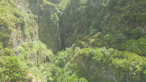 Drone-view-of-two-hidden-waterfalls-at-"Rocha-do-Navio",-Santana,-Madeira-island