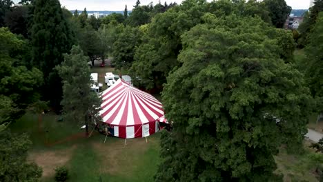 Circus-Tent-Surrounded-By-The-Lush-Green-Trees-In-The-Park
