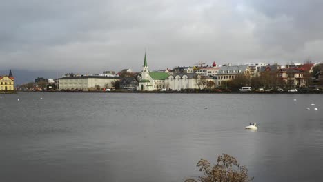 Beautiful-Cityscape-Of-Reykjavik-Iceland-By-The-Lake-On-A-Cloudy-Afternoon---wide-shot