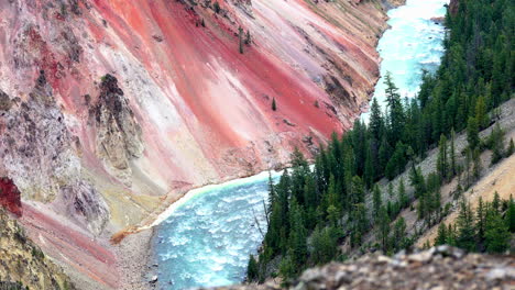 Yellowstone-River-bends-around-colorful-fumarole-stained-volcanic-scree