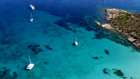 Top-Down-Aerial-Drone-View-of-Cala-Sabina,-Aranci-Gulf,-Emerald-Coast,-Sardinia,-Italy