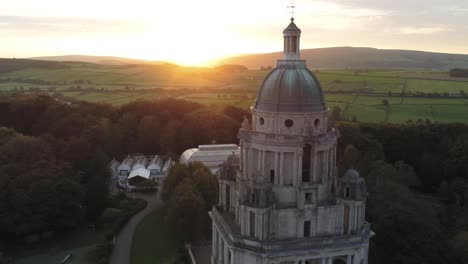 Ashton-memorial-English-dome-folly-landmark-closeup-Lancashire-countryside-passing-sunrise-Aerial-dolly-right-view